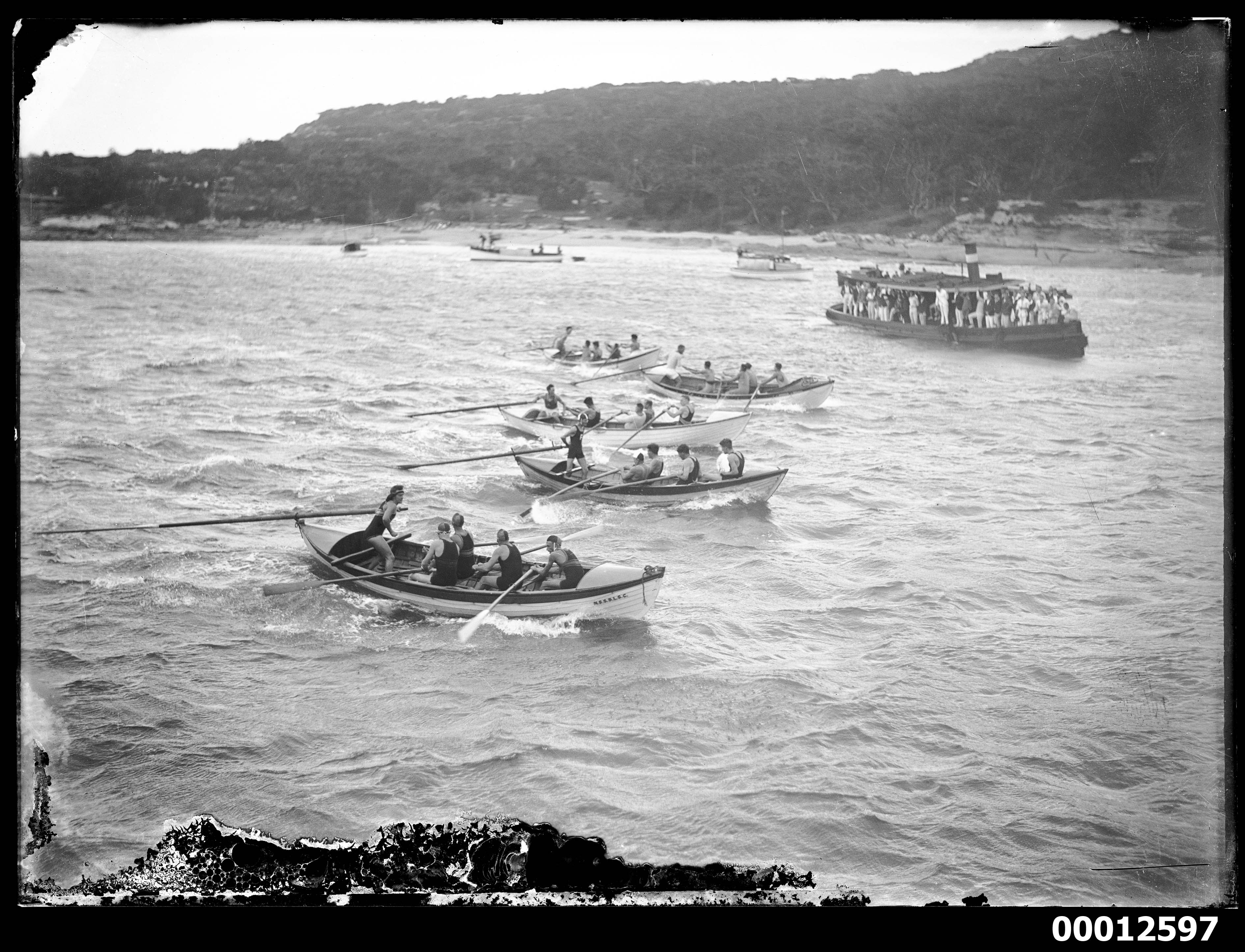 Surf lifesaving boats racing on Sydney Harbour