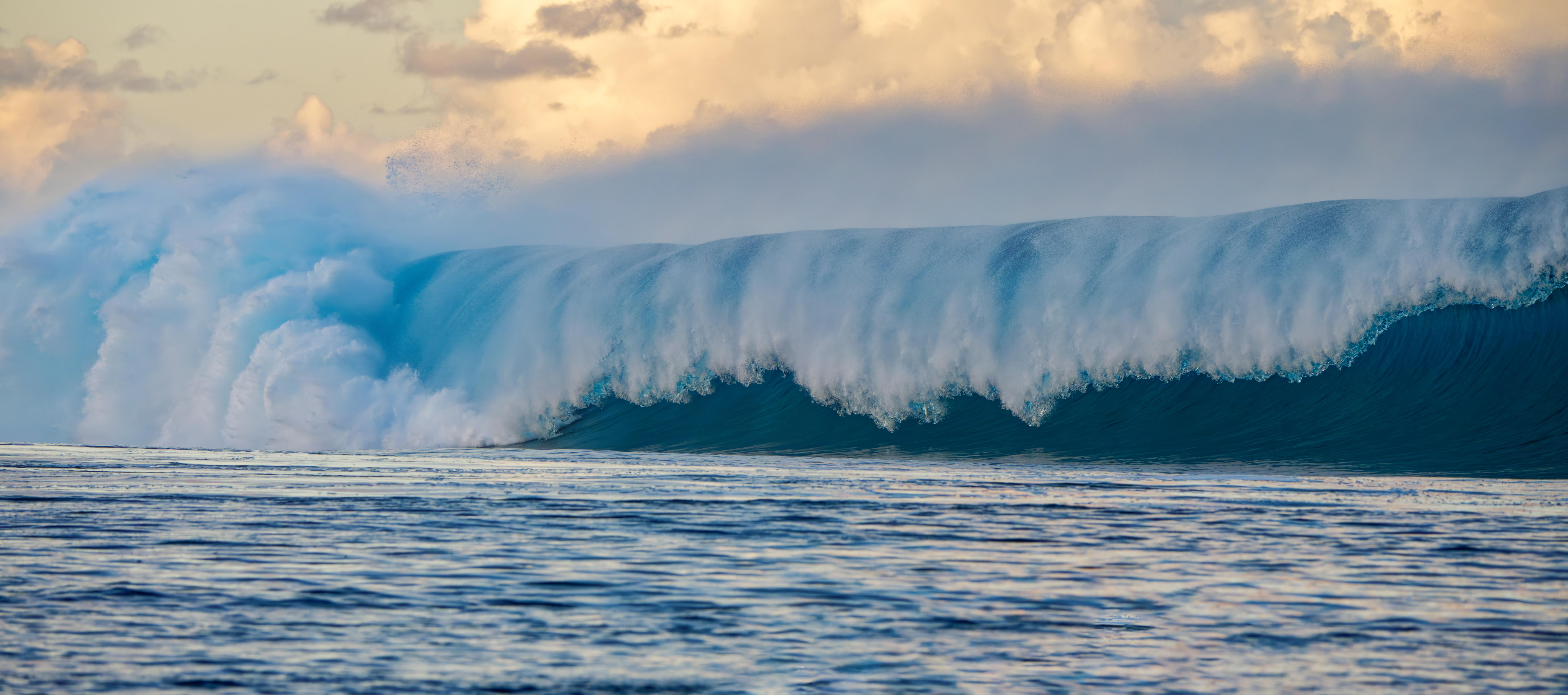 The Teahupoʻo wave breaks unbroken across the shallow reef of Passe Havae
